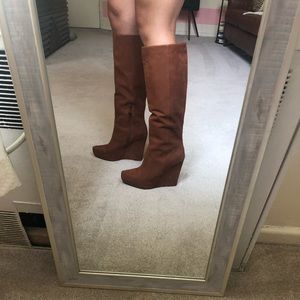 Tall brown, wedge boots.